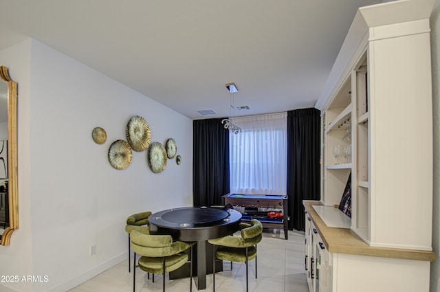 dining area featuring light tile patterned floors