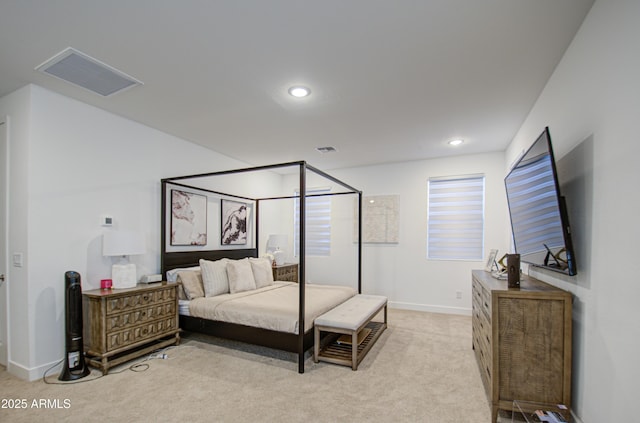 bedroom featuring light carpet