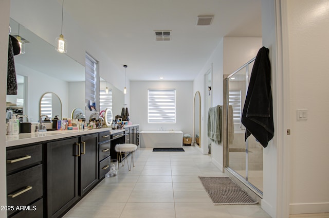 bathroom featuring tile patterned flooring, plus walk in shower, and vanity