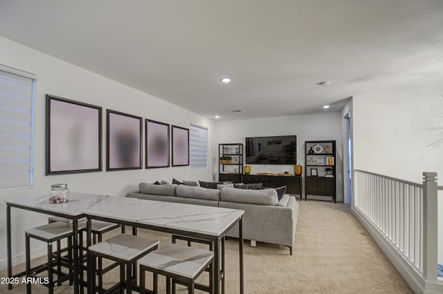 living room featuring light carpet