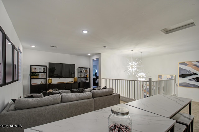 living room with an inviting chandelier