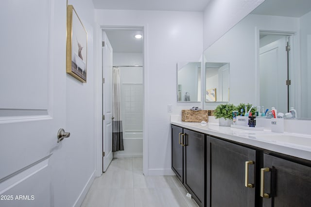 bathroom featuring vanity, tile patterned flooring, and shower / bath combo