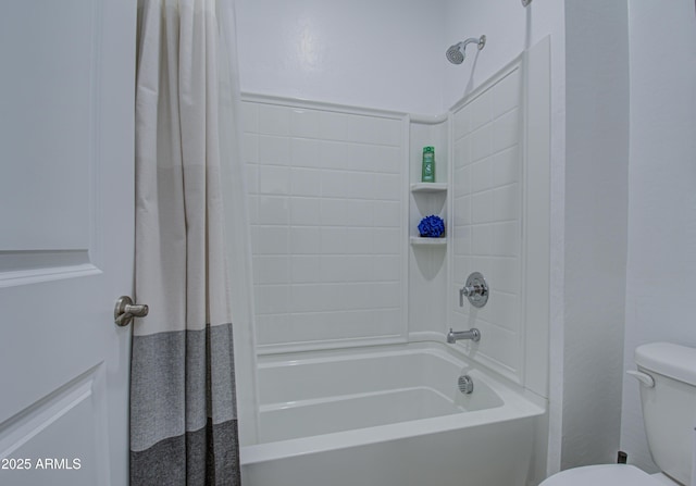 bathroom featuring shower / bath combination with curtain and toilet