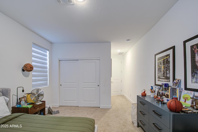 carpeted bedroom with a closet