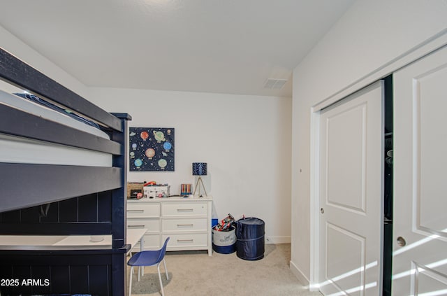 bedroom featuring light colored carpet