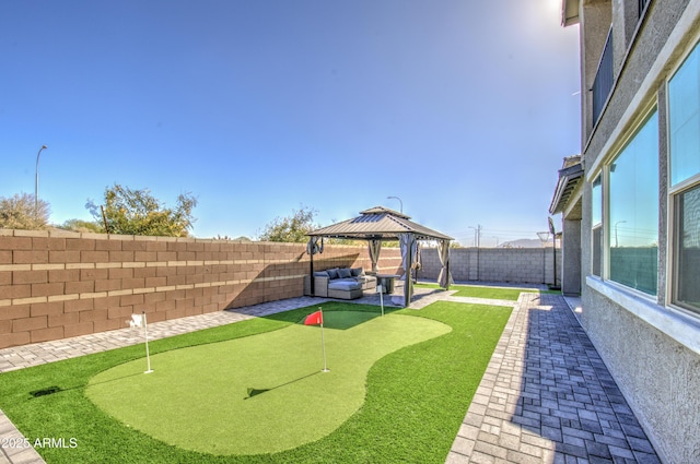 view of yard featuring a gazebo, outdoor lounge area, and a patio