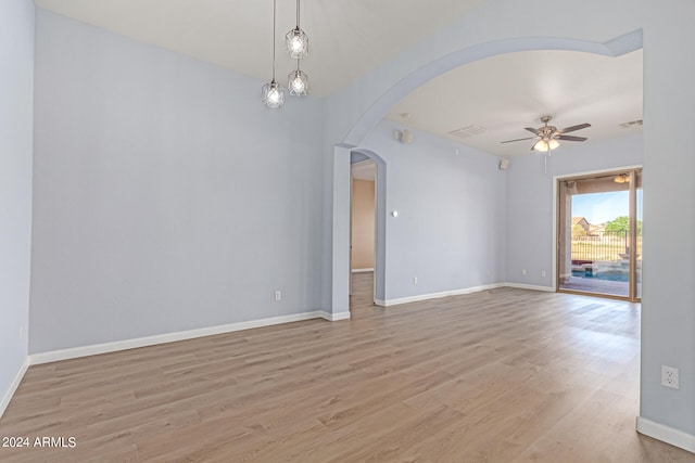 unfurnished room featuring ceiling fan and light hardwood / wood-style flooring