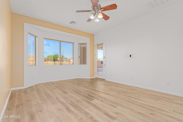 spare room with ceiling fan and light hardwood / wood-style flooring