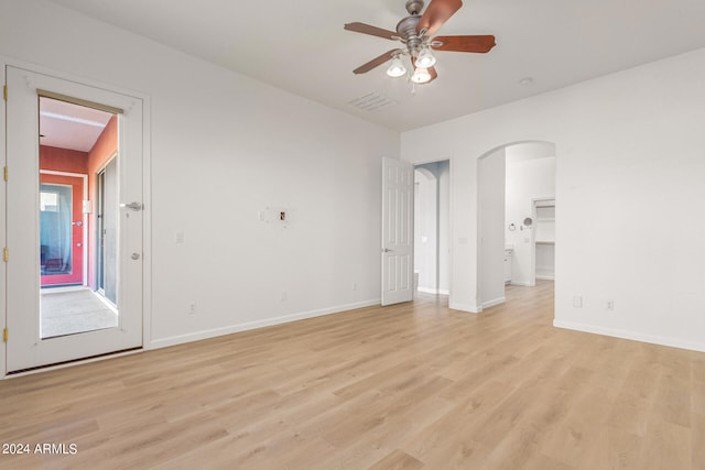 spare room featuring ceiling fan and light hardwood / wood-style floors