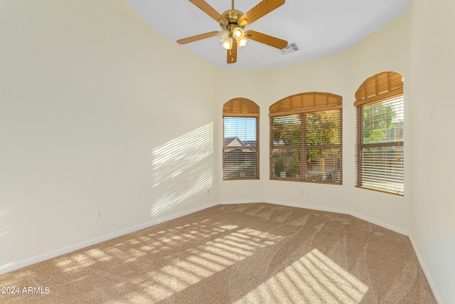 empty room with carpet and ceiling fan