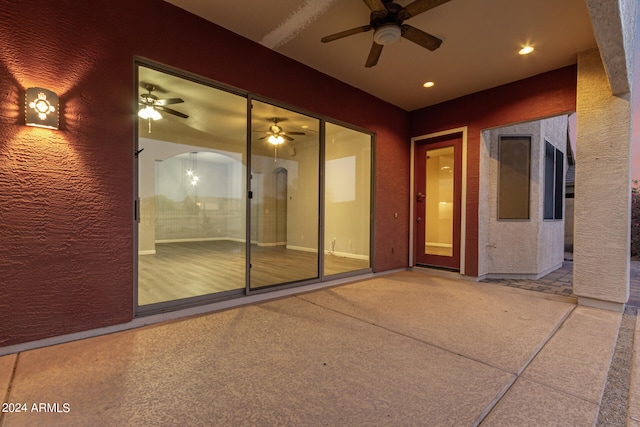 view of patio featuring ceiling fan