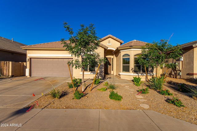 mediterranean / spanish-style house featuring a garage