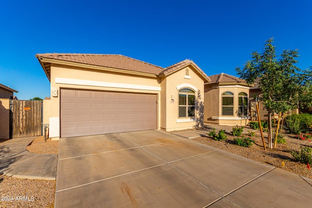 mediterranean / spanish-style house featuring a garage