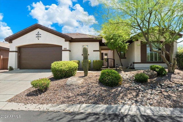 41817 N Bridlewood Way, Phoenix, AZ 85086 - view of front of property with driveway, stucco siding, and a garage