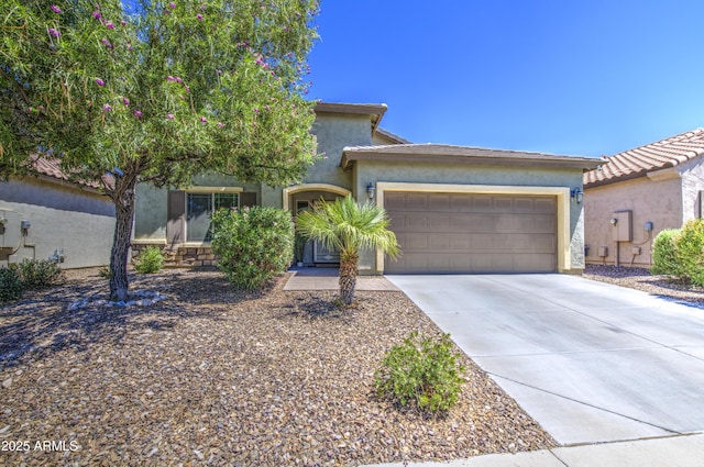 6554 W Rushmore Way, Florence, AZ 85132 - view of front of house with an attached garage, driveway, and stucco siding