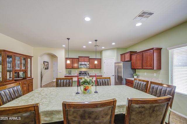 6554 W Rushmore Way, Florence, AZ 85132 - dining area with arched walkways and recessed lighting
