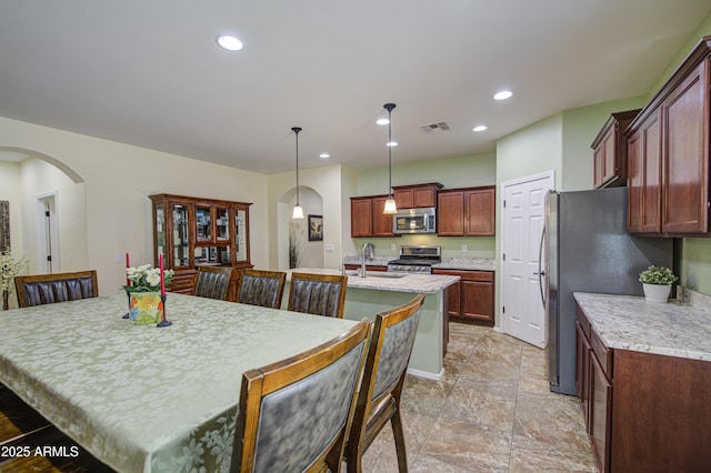 6554 W Rushmore Way, Florence, AZ 85132 - dining room featuring arched walkways and recessed lighting