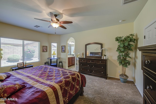 6554 W Rushmore Way, Florence, AZ 85132 - carpeted bedroom featuring a ceiling fan and ensuite bathroom