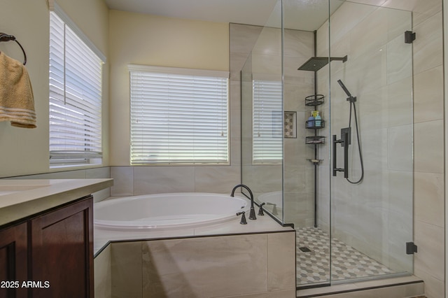 6554 W Rushmore Way, Florence, AZ 85132 - bathroom with a garden tub, a stall shower, and vanity
