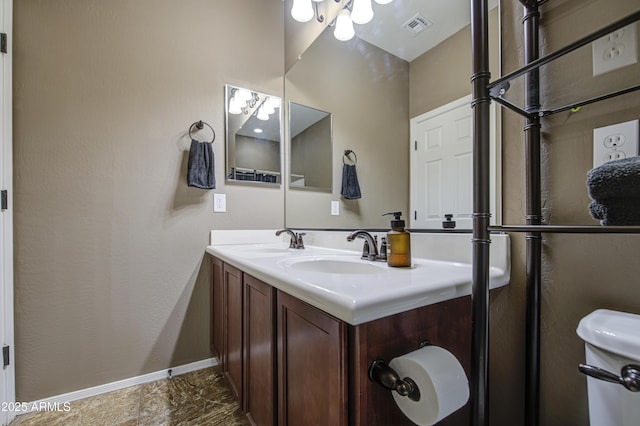 6554 W Rushmore Way, Florence, AZ 85132 - bathroom featuring double vanity and baseboards
