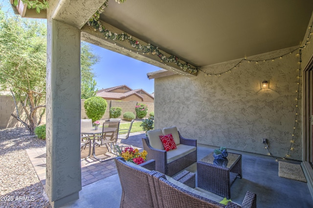 6554 W Rushmore Way, Florence, AZ 85132 - fenced backyard with outdoor dining space, a patio area, and an outdoor living space