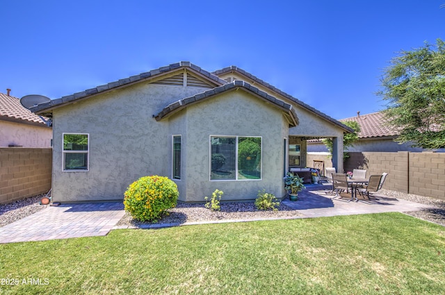 6554 W Rushmore Way, Florence, AZ 85132 - back of house featuring a patio area and stucco siding