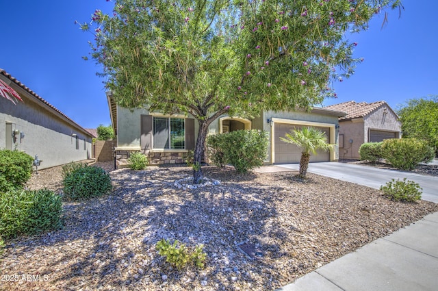 6554 W Rushmore Way, Florence, AZ 85132 - view of front of house with concrete driveway, stucco siding, a garage, and a tiled roof
