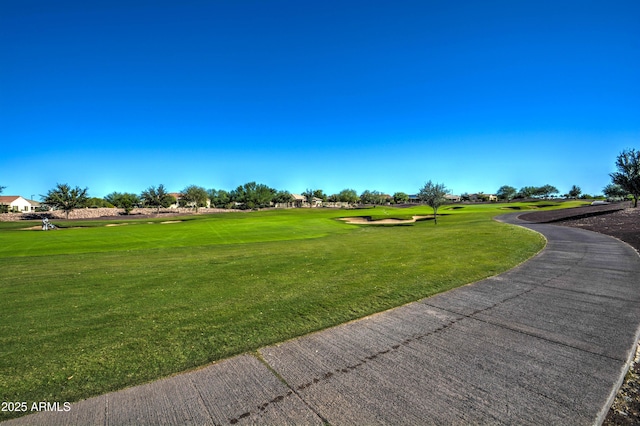 6554 W Rushmore Way, Florence, AZ 85132 - surrounding community featuring a lawn and view of golf course