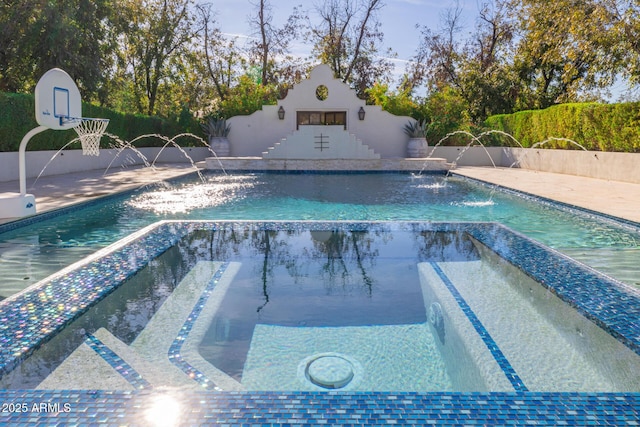 view of pool featuring a jacuzzi and pool water feature