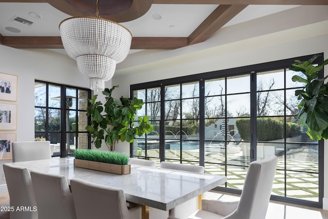 dining room featuring beam ceiling and a chandelier