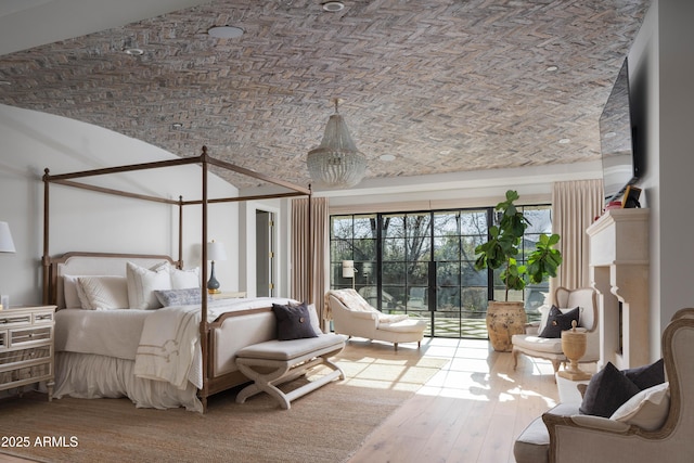 bedroom featuring brick ceiling, lofted ceiling, and hardwood / wood-style floors