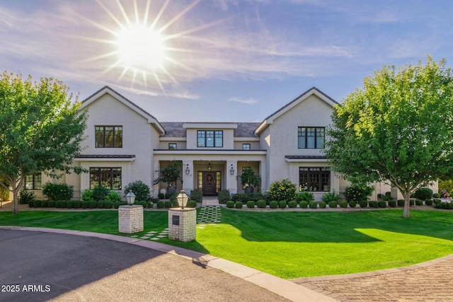 view of front of home featuring a front lawn