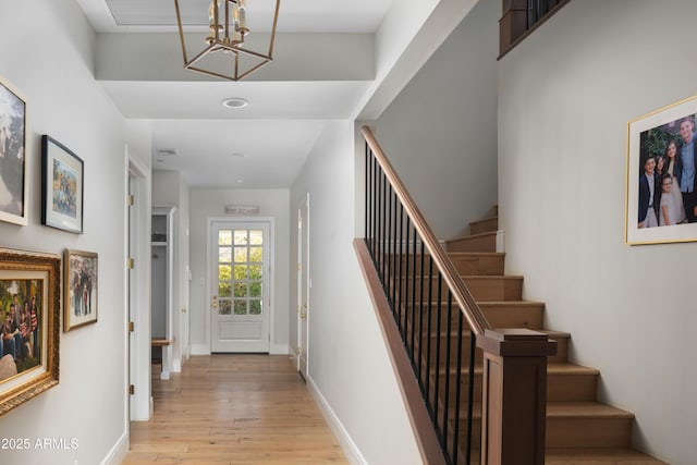 staircase featuring wood-type flooring