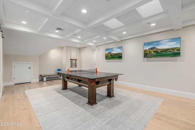 game room with beam ceiling and light wood-type flooring