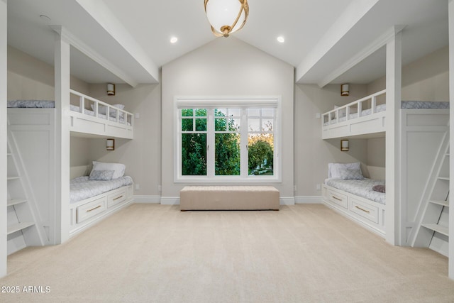 unfurnished bedroom with lofted ceiling and light colored carpet