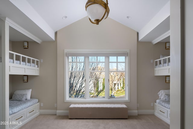 unfurnished bedroom with lofted ceiling and light colored carpet