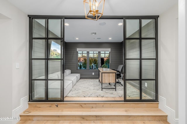 office featuring an inviting chandelier