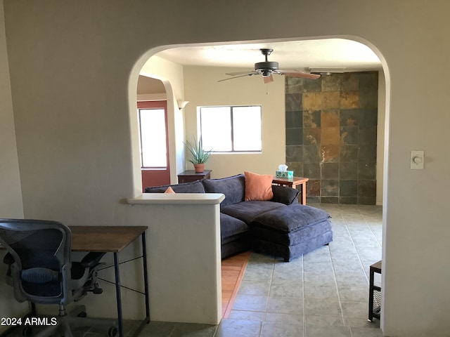 7857 W Winchester Easement, Willcox, AZ 85643 - living area with arched walkways and a ceiling fan