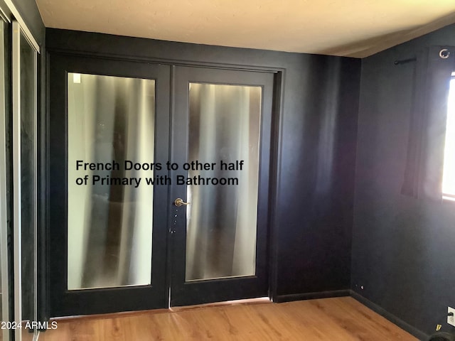7857 W Winchester Easement, Willcox, AZ 85643 - detailed view of wood finished floors, french doors, and baseboards