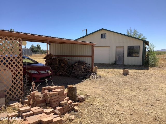 7857 W Winchester Easement, Willcox, AZ 85643 - view of side of property featuring an outbuilding, a garage, and dirt driveway