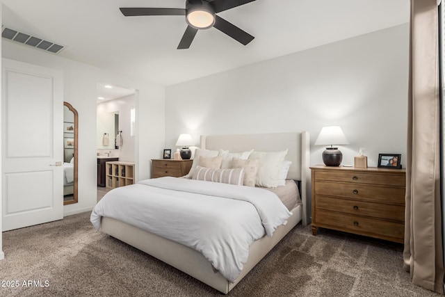 bedroom featuring ceiling fan and dark colored carpet