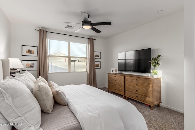 bedroom featuring ceiling fan and carpet