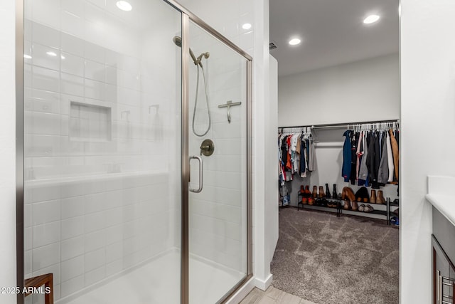 bathroom with vanity and an enclosed shower