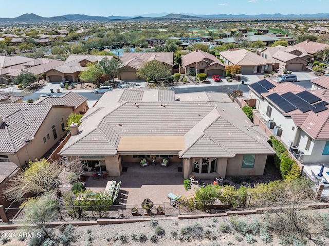 birds eye view of property featuring a mountain view