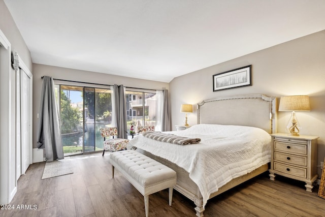 bedroom featuring hardwood / wood-style floors and access to exterior