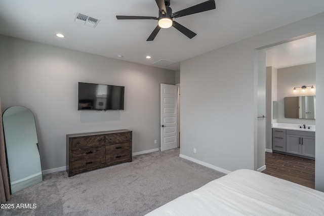12702 W Sierra Vista Dr, Glendale, AZ 85307 - bedroom with recessed lighting, visible vents, connected bathroom, a sink, and baseboards