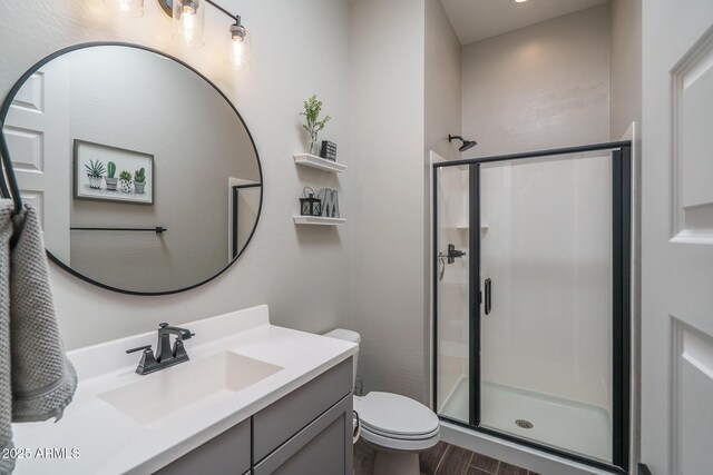 12702 W Sierra Vista Dr, Glendale, AZ 85307 - bathroom featuring toilet, a stall shower, wood finished floors, and vanity