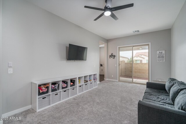 12702 W Sierra Vista Dr, Glendale, AZ 85307 - carpeted living area featuring baseboards, visible vents, and ceiling fan