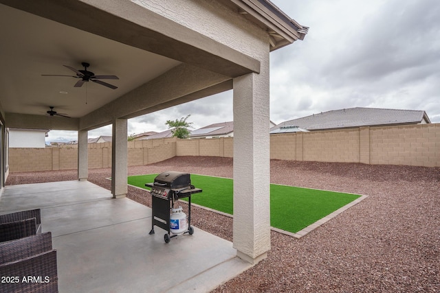12702 W Sierra Vista Dr, Glendale, AZ 85307 - view of patio featuring a fenced backyard, a grill, and a ceiling fan