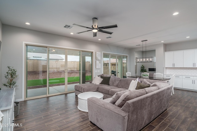 12702 W Sierra Vista Dr, Glendale, AZ 85307 - living area featuring recessed lighting, visible vents, and wood tiled floor